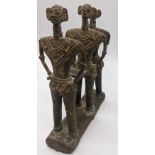 An early 20th century Indian bronze figure group of three defied clan figures, Orissa, India, H.16cm