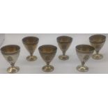 A set of 6 19th century French silver egg cups by Henri-Louis Chenailler with applied lion head