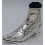 A large silver pin cushion in form of a boot, hallmarked London, 1858, maker John Grinsell & Sons,