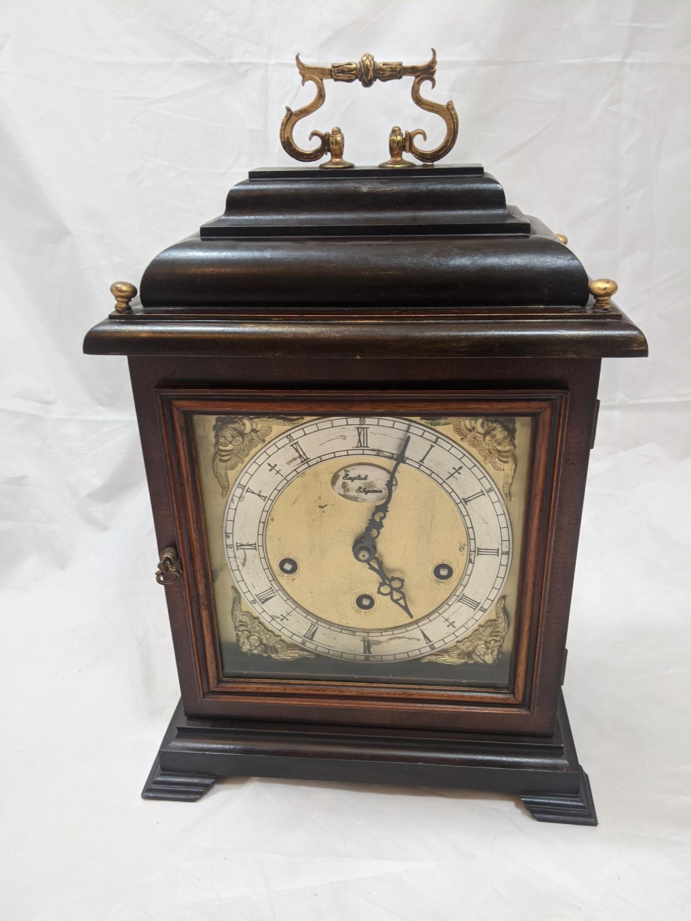 A 19th century mantel clock, three train striking, mahogany cased with fretwork side panels