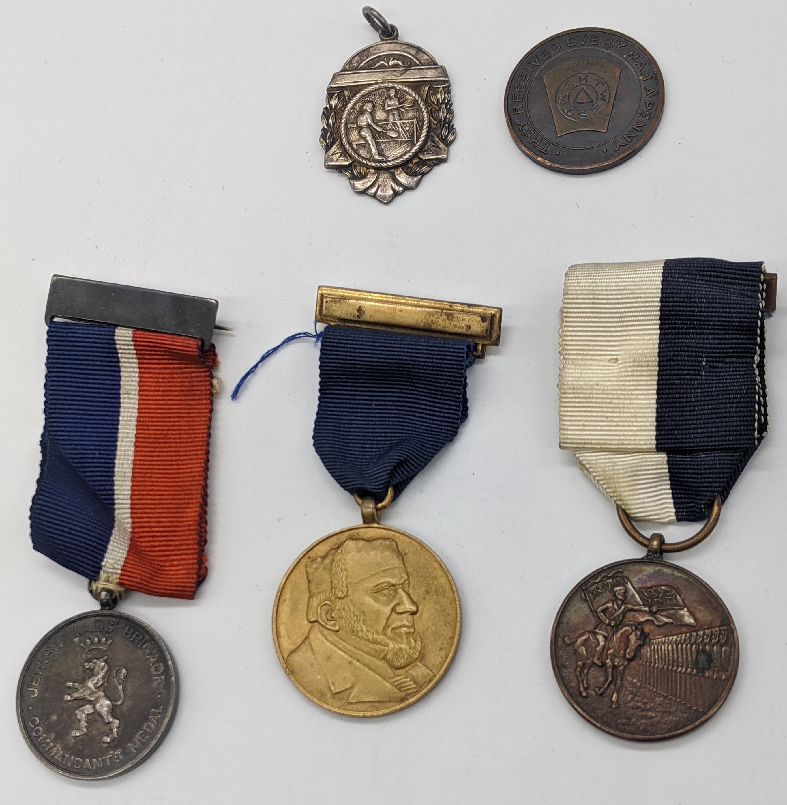 A collection of Jewish and Masonic medals. A bronze Lewis Emanuel Jewish Lads` Brigade medal,