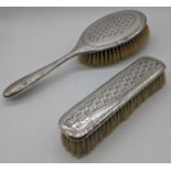 Two Liberty & Co. Arts and Crafts silver brushes, hallmarked Birmingham, 1916.