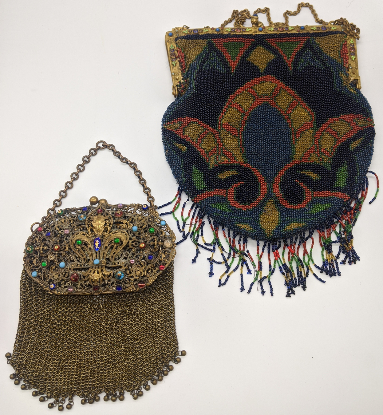 In the manner of Faberge, two Russian mesh handbags, mounted with enameling and coloured stones.