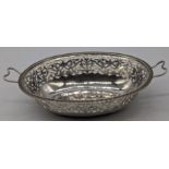 An early 19th century Austrian silver twin handled dish, fret cut decor, marked to interior base,