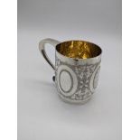 A Victorian silver mug, gilt interior, hallmarked London, 1871, maker Daniel and Charles Houle,