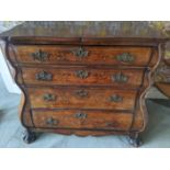 An 18th century Dutch floral marquetry inlaid bombe commode/ chest of drawers, four long drawers,