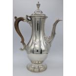 A George III silver coffee pot by Charles Wright, coat of arms to one side, beaded borders and urn