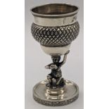 A Continental silver Kiddush cup man holding up cup, crown mark to rim, 110g, H.10.5cm