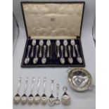 A collection of silver to include a cased set of 12 spoons (tongs not original), 6 teaspoons, a