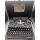 An Oliver portable typewriter, retailed by Harrods, 1954