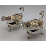 A pair of George III silver sauceboats by William & James Priest, hallmarked London, 497g, H.12cm
