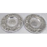A pair of 17th century German silver plates, Augsburg marks, embossed with birds and fruit, 705g,