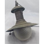 An Edwardian brass hanging lamp, a cast embosssing, release lever to underside, glass shade, circa