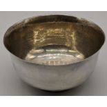An early 20th century silver bowl by Charlie Jacques, hallmarked London 1904, planished finish,