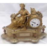 A late 19th/early 20th century French mantel clock, reclining figure raised on alabaster base, 8 day