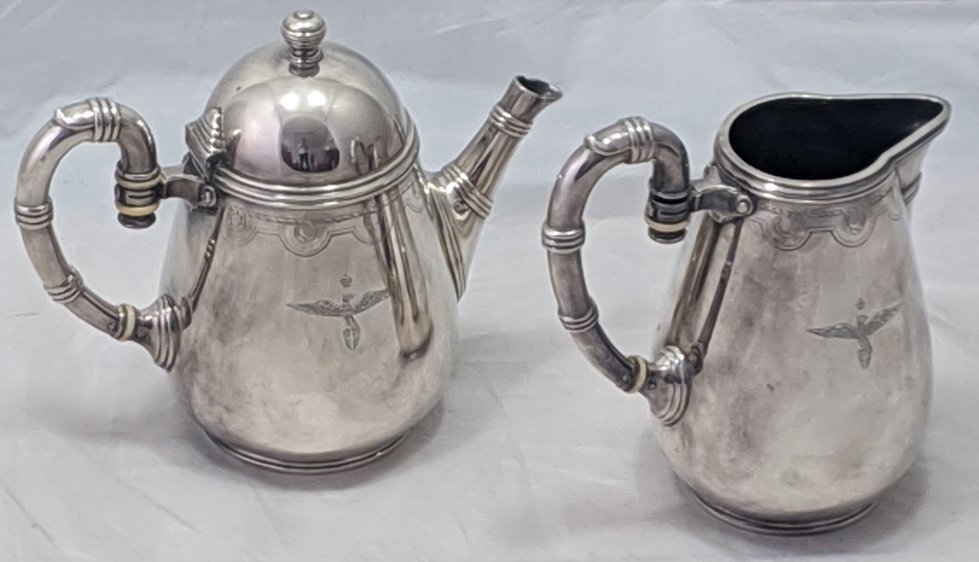 Fratelli Broggi, Milano, an unusual Italian silver plated teapot and water jug, banded handles and