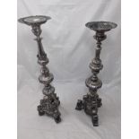 A very large and imposing pair of silver Continental pricket sticks, the stems of baluster form on