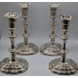 A set of four George II silver candlesticks, London 1740-50, a visible makers mark of Edward Feline,
