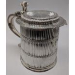 A William III silver tankard with flat top lid, S-shape handle and scrolling thumbpiece, the