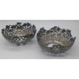 A pair of late 19th century Chinese export silver tea bowl holders by Wang Hing, pierced bamboo