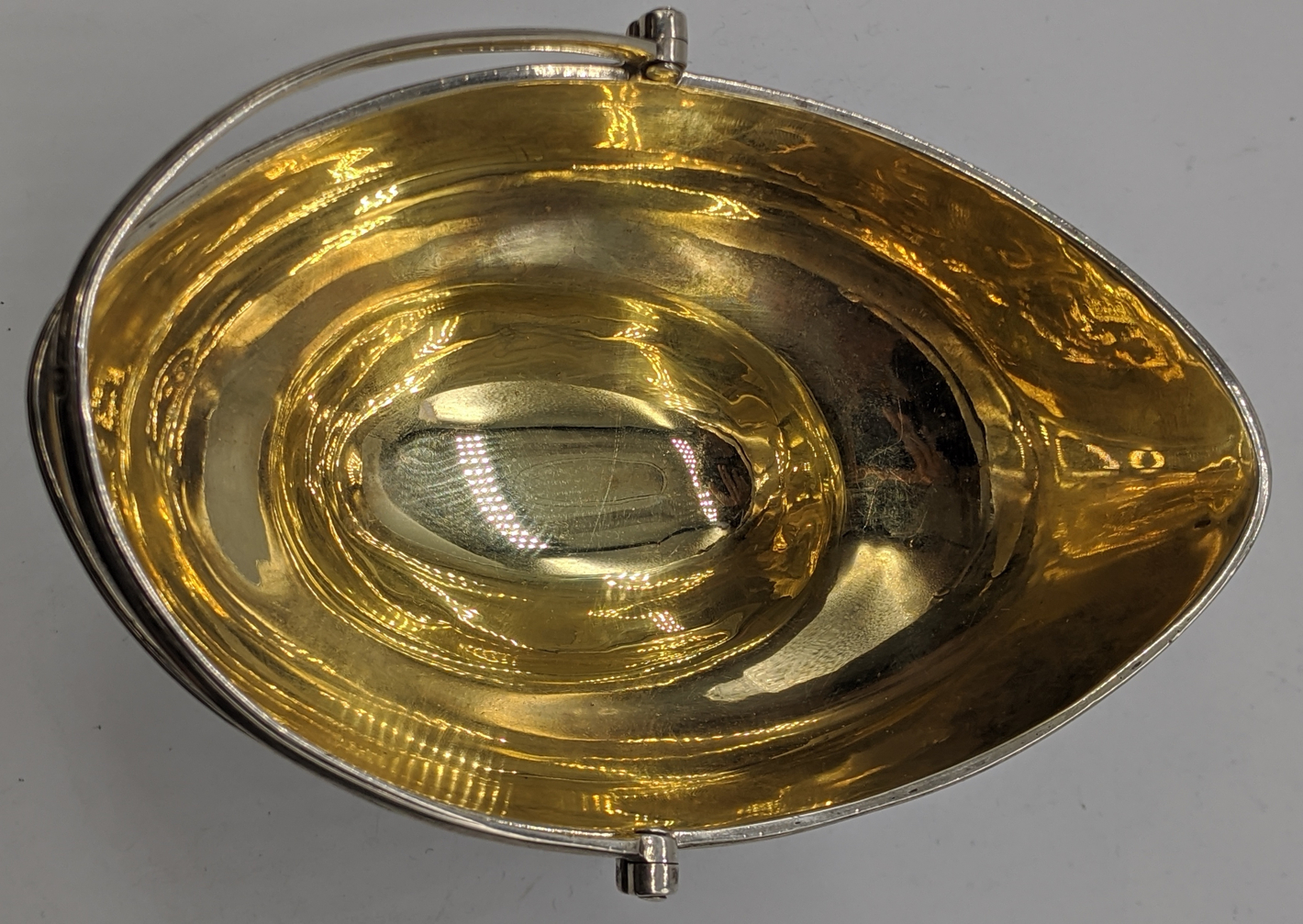 A George III silver sugar basket by George Burrows, gilt interior, vacant cartouches, swing - Image 2 of 4