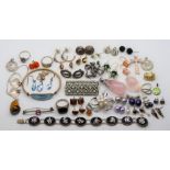 A collection of silver jewellery to include brooches, earrings, bracelets, amber, pearls, tiger eye,