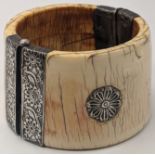 A 19th century Indian silver mounted ivory cuff bracelet, D.8.5cm