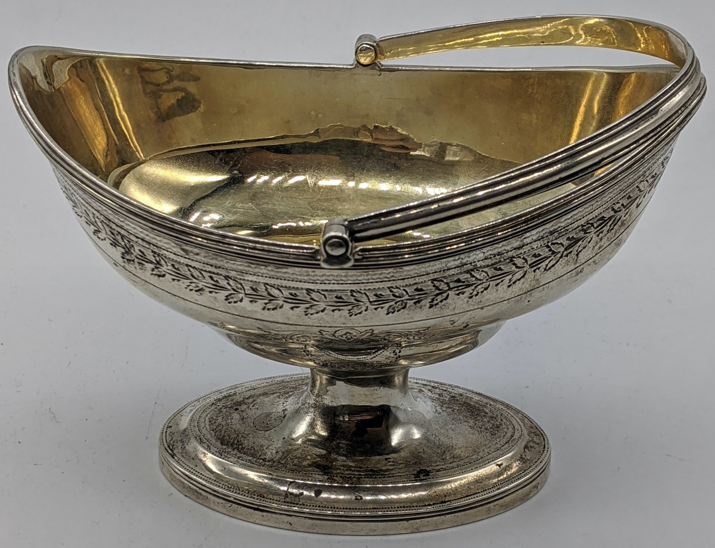 A George III silver sugar basket by George Burrows, gilt interior, vacant cartouches, swing - Image 4 of 4