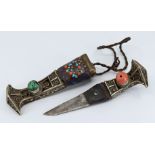 A 19th Century silver Tibetan dagger with turquoise & coral insets mounted in bezels