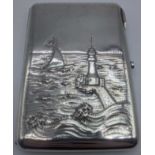 A Russian silver case depicting a lighthouse and yacht at sea, gilt interior, marks to the interior,