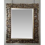 A 19th century carved giltwood wall mirror, later bevelled glass, H.101cm