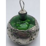 A late 19th/early 20th century Chinese export silver and green glass scent bottle, of spherical