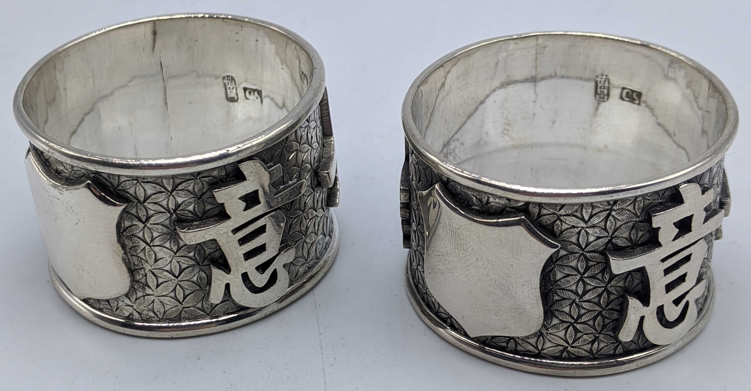 A pair of Chinese silver napkin rings, character marks and vacant cartouche, marks to the inside - Image 2 of 3