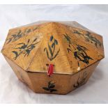 A 19th century octagonal wooden turban box, decorated with floral designs on each panel, probably