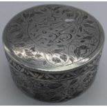 A Persian silver round box, etched flora and fauna decor, with Farsi inscription to lid, 92g, D.6.