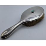 A Liberty & Co. silver brush with mounted turquoise stone, hallmarked Birmingham, L.25cm