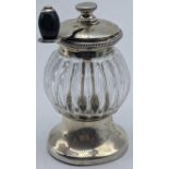 A Victorian silver and glass pepper grinder, hallmarked Birmingham, 1886, maker Hukin & Heath, H.9.