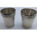 A pair of George III double barrel beakers, makers mark possibly Samuel Whitford, inscription to