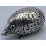 A silver pin cushion in the form of a hedgehog, hallmarked Birmingham, 1905, maker L&S, H.4cm W.6.