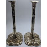 A pair of George III silver candlesticks, hallmarked London, maker T.H., filled bases, 1253g, H.