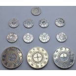 An unusual collection of Bvlagari silver casino chips/tokens, each individually hallmarked ,