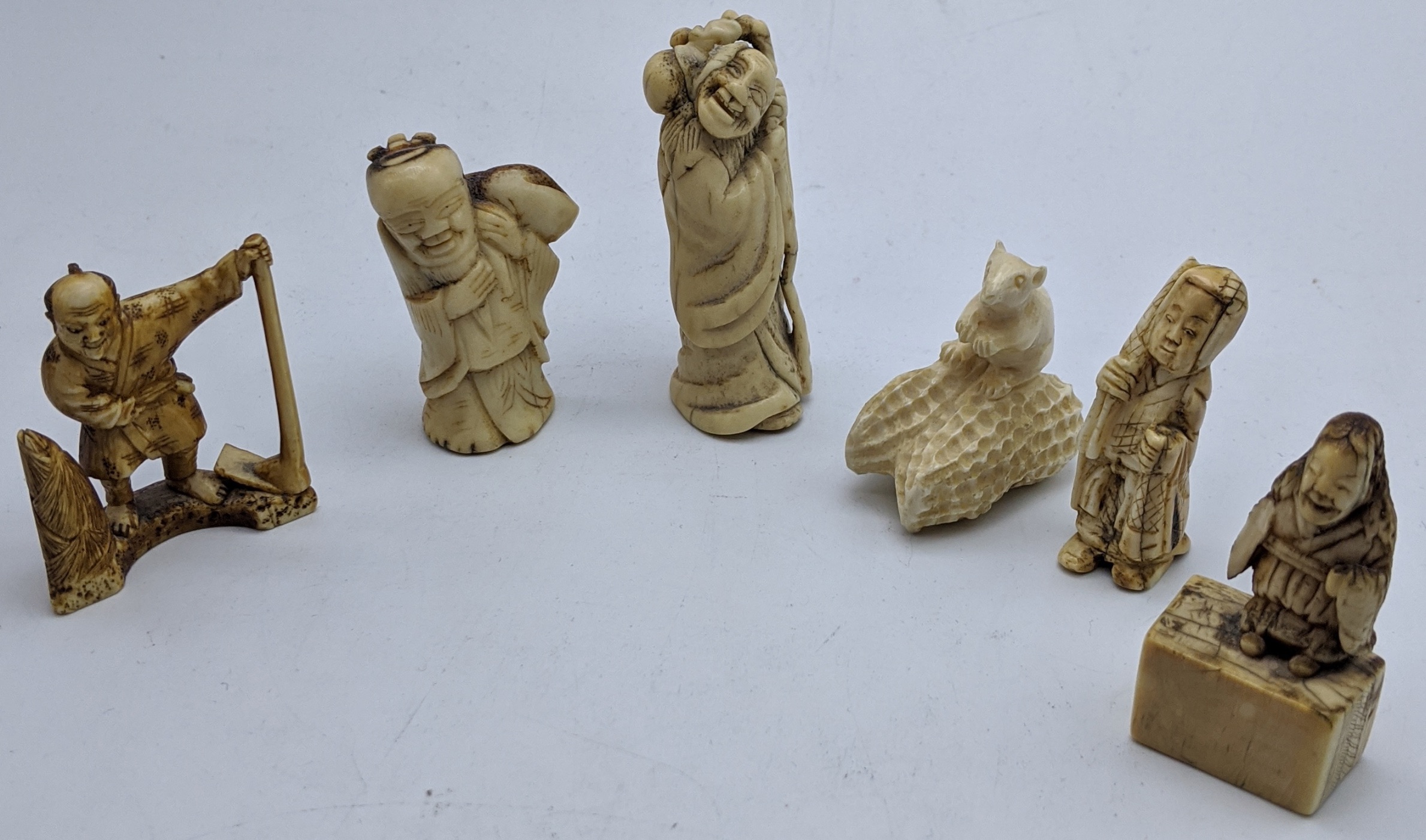 Six late 19th/early 20th century Japanese bone and ivory netsukes, H.6cm (largest) Buyer Note: