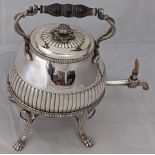 A George III silver kettle on stand, handle mounts in the form of serpents, raised on four paw feet,