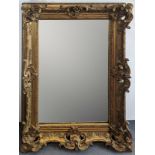 A large giltwood wall mirror, H.144cm W.110cm D.14cm