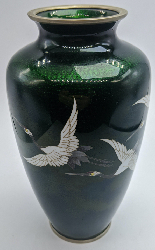 A Japanese Ginbari cloisonne enamel vase, emerald green ground with flying cranes, mark to base rim,