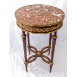 A Louis XVI style mahogany gueridon, red marble top, the frieze mounted with ormolu appliques,