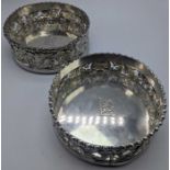 A pair of Georgian silver coasters, central crests, 742g, D.13.5cm