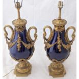 A pair of French ormolu mounted cobalt blue porcelain vases, swan neck handles, late 19th century,