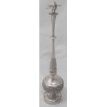 A late 19th century Chinese export silver rose water sprinkler, repousse embossed base and body,