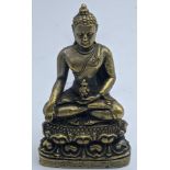 A yellow metal Thai seated Buddha, Thailand, H.6cm